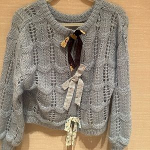 Blue cardigan with bow details
